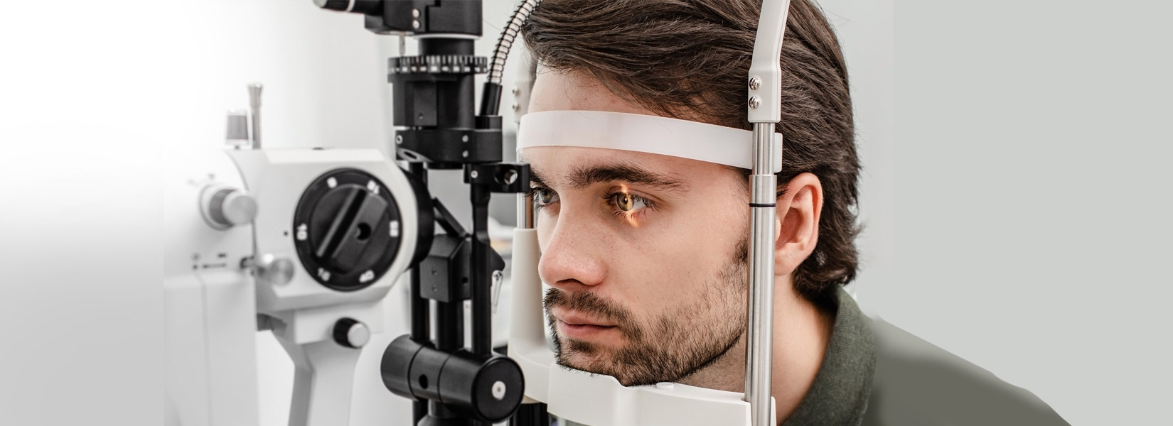 young man during eye exam in Laurie